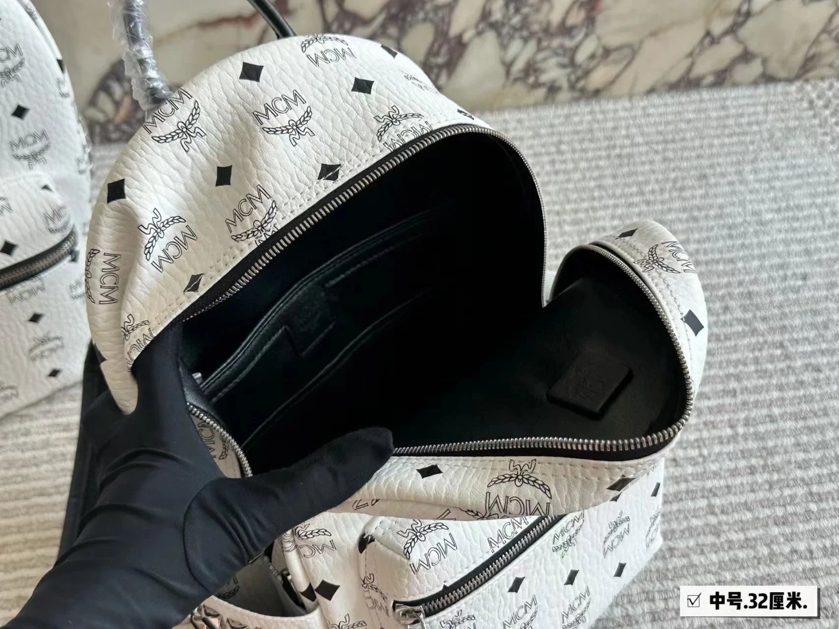 MCM Backpacks Visetos logo-print studded backpack image 12