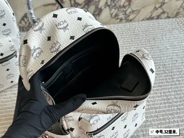 MCM Backpacks Visetos logo-print studded backpack product detail image 12