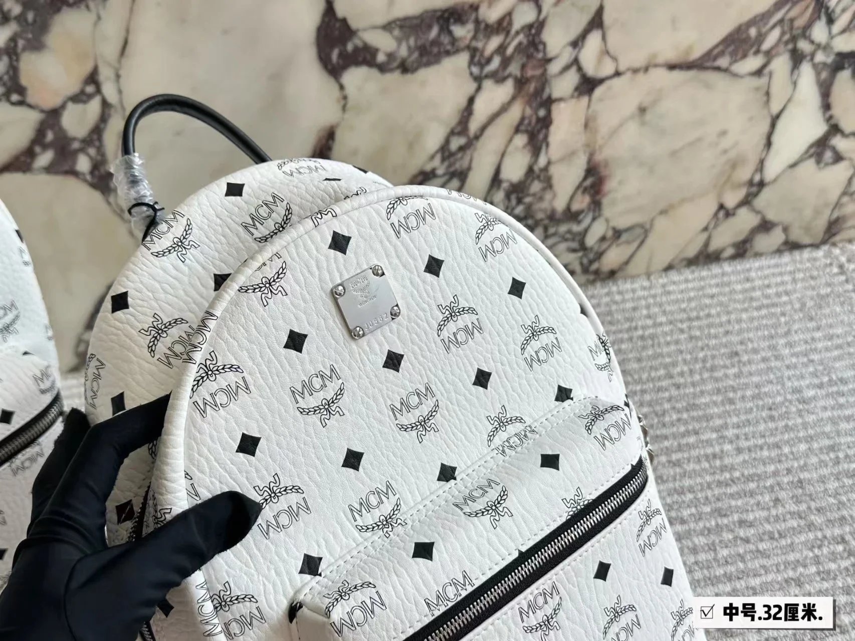 MCM Backpacks Visetos logo-print studded backpack image 7