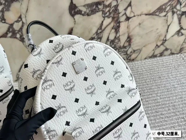 MCM Backpacks Visetos logo-print studded backpack product detail image 7