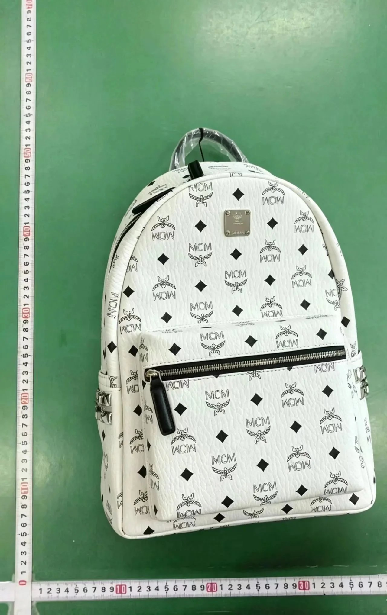 MCM Backpacks Visetos logo-print studded backpack image 4