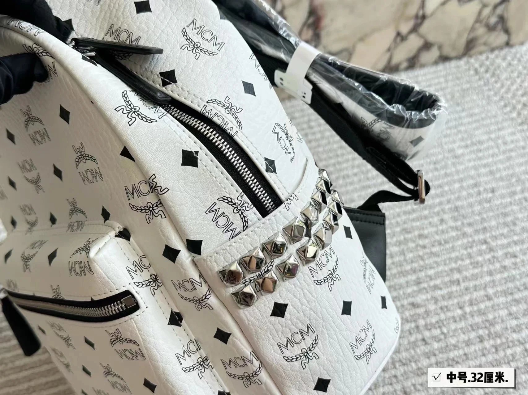 MCM Backpacks Visetos logo-print studded backpack image 10