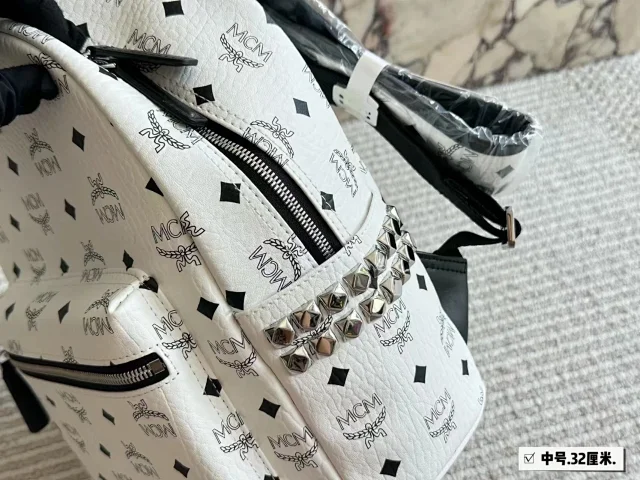 MCM Backpacks Visetos logo-print studded backpack product detail image 10