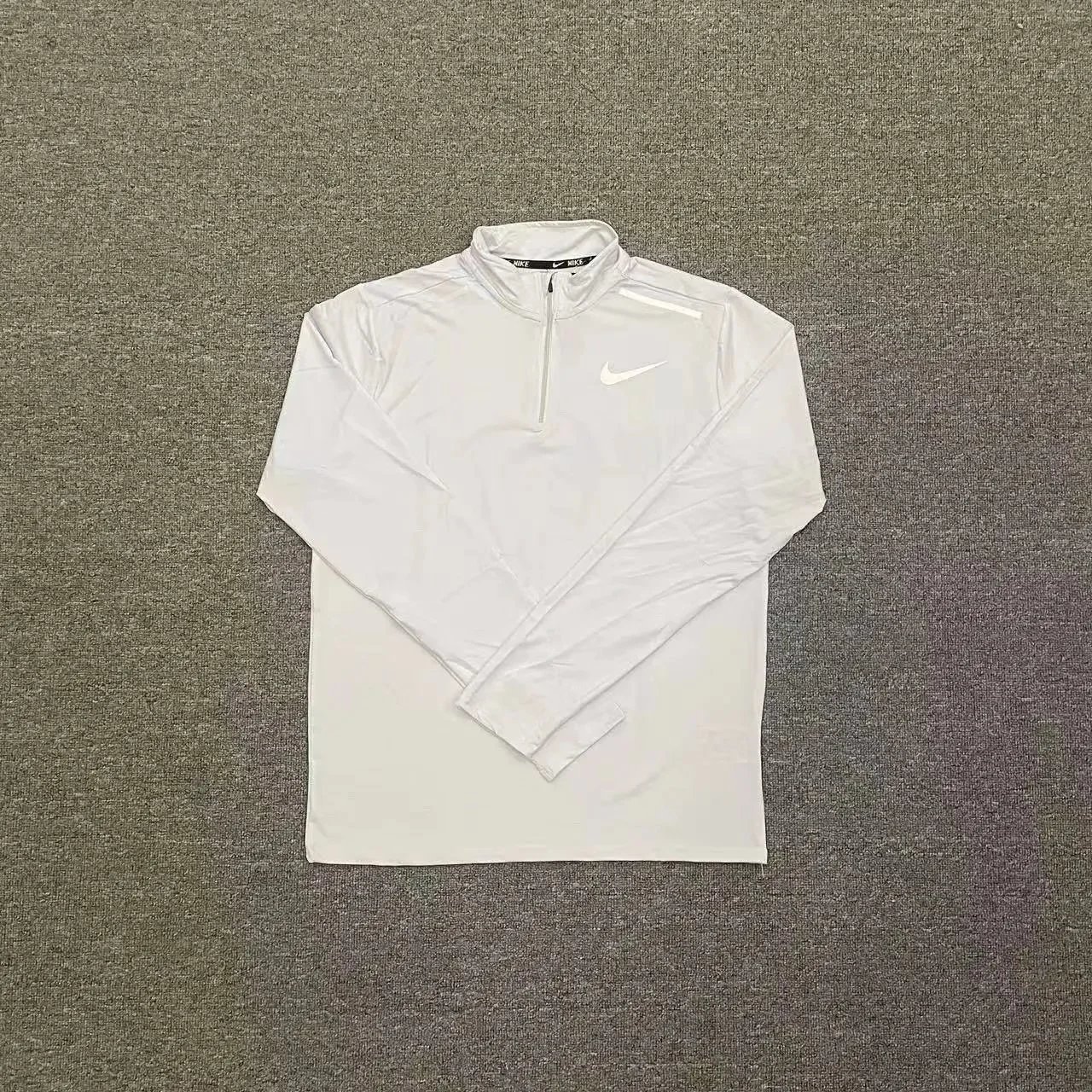 Nike Trousers Tapered running with zip pockets and reflective details — White reflectivity