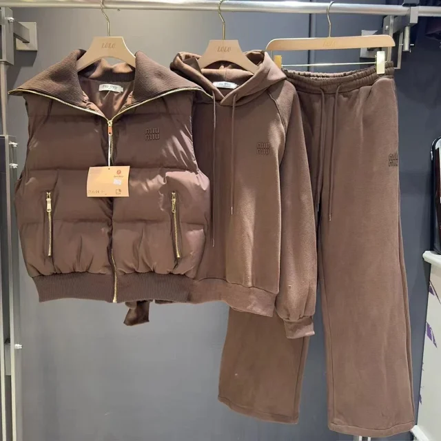 Miu Matching Sets Three-piece set with padded zip vest, hooded sweatshirt and wide-leg trousers product detail image 3