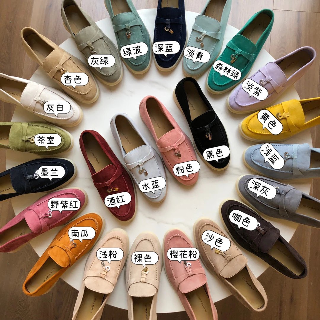 Genuine leather loafers with tassels and pendants trimmed flats