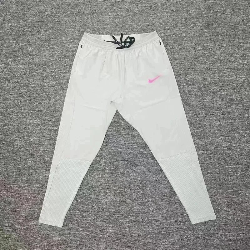 Nike Trousers Tapered running with zip pockets and reflective details — 8