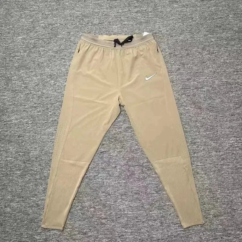 Nike Trousers Tapered running with zip pockets and reflective details — 14