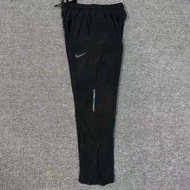 Nike Trousers Tapered running with zip pockets and reflective details — 3 Black