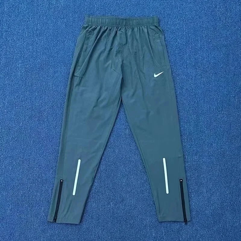 Nike Trousers Tapered running with zip pockets and reflective details — 2