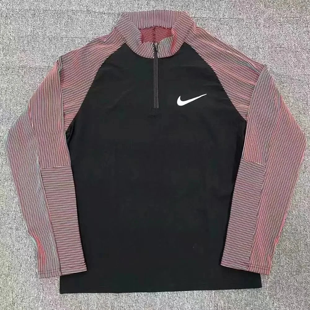 Nike Trousers Tapered running with zip pockets and reflective details — Threaded half-zip -3