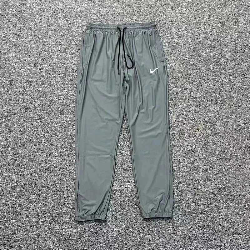 Nike Trousers Tapered running with zip pockets and reflective details — 4