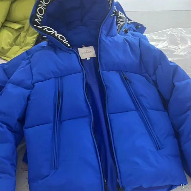 Moncler Down Jackets Hooded puffer jacket with logo trim product detail image 2