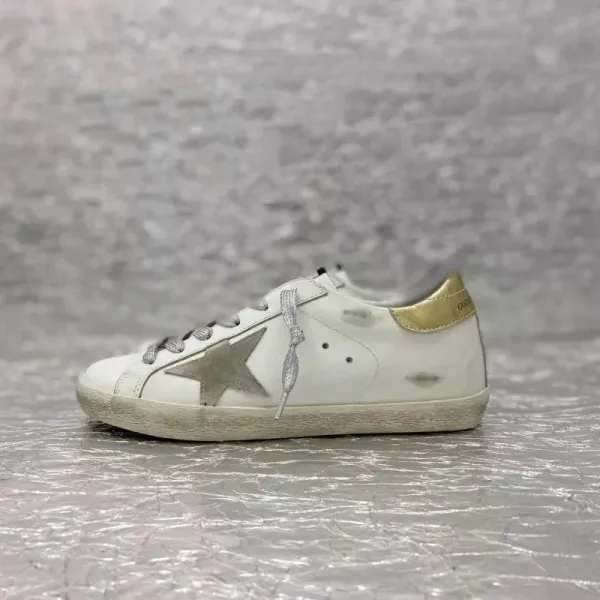 Golden Goose Superstar White and Gold Distressed Sneakers - 1