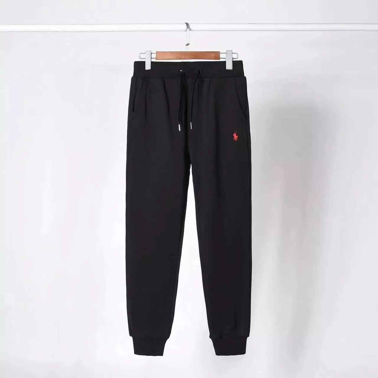 Black and red marked pants