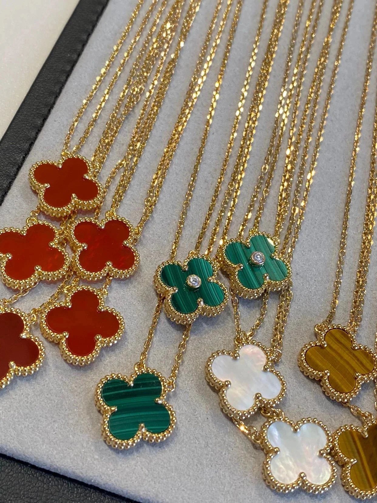 Van Cleef & Arpels Style Vintage Alhambra Clover Necklaces in Multiple Colors (Red Carnelian, Malachite, Tiger's Eye, Onyx, Mother-of-Pearl)