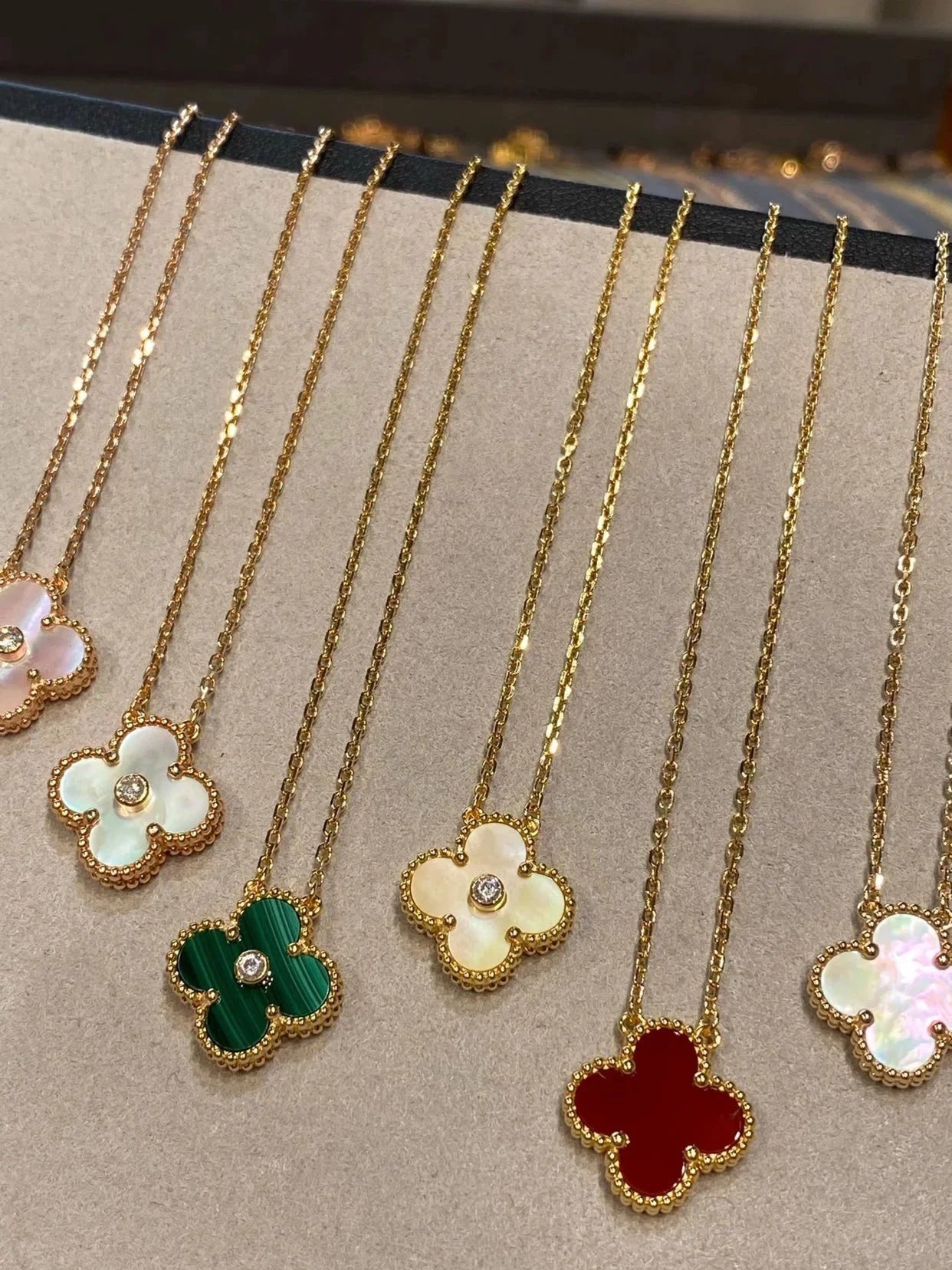 Van Cleef & Arpels Style Vintage Alhambra Clover Necklaces in Multiple Colors (Red Carnelian, Malachite, Tiger's Eye, Onyx, Mother-of-Pearl)
