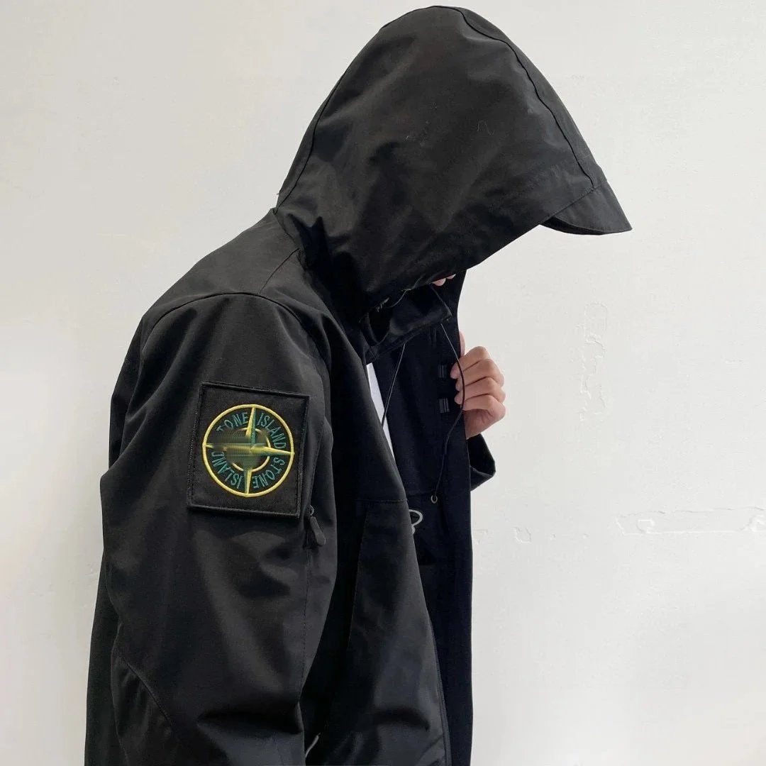 Stone hooded punching jacket jacket outdoor hiking waterproof mountaineering clothing men and women tide