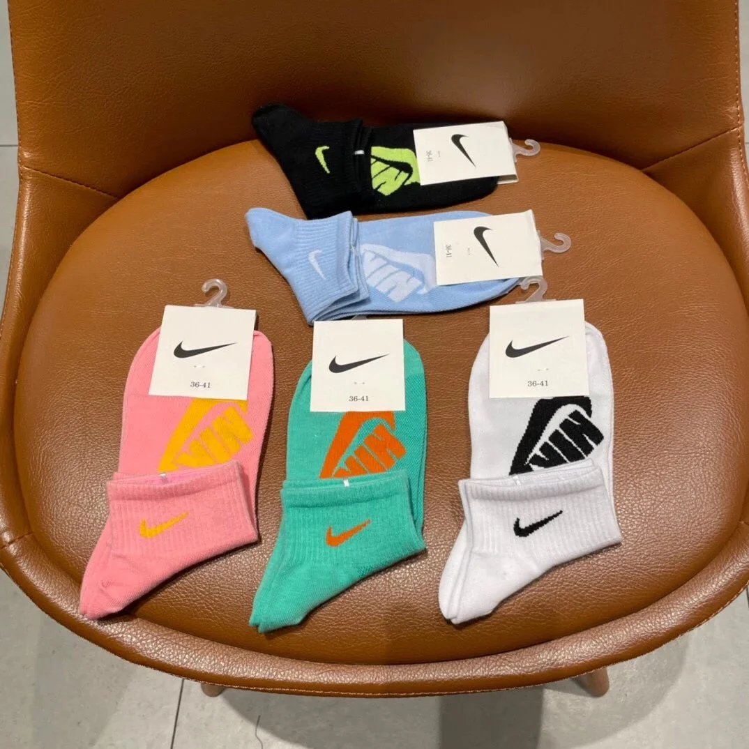 Nike Swoosh Logo Crew Socks in Navy, White, Gray, Black, and Charcoal - 10