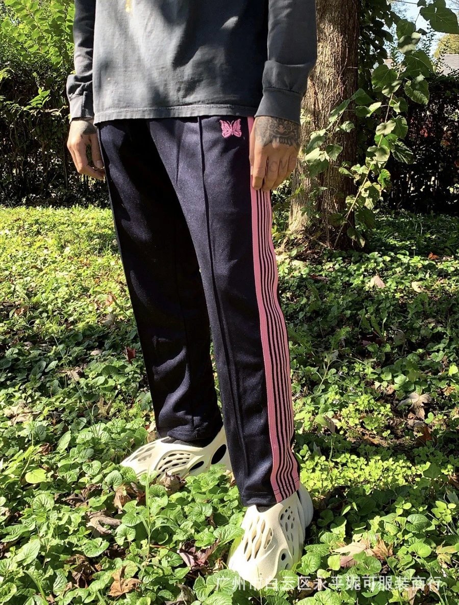 Needles-Inspired Black Track Pants with Butterfly Logo and Side Stripes