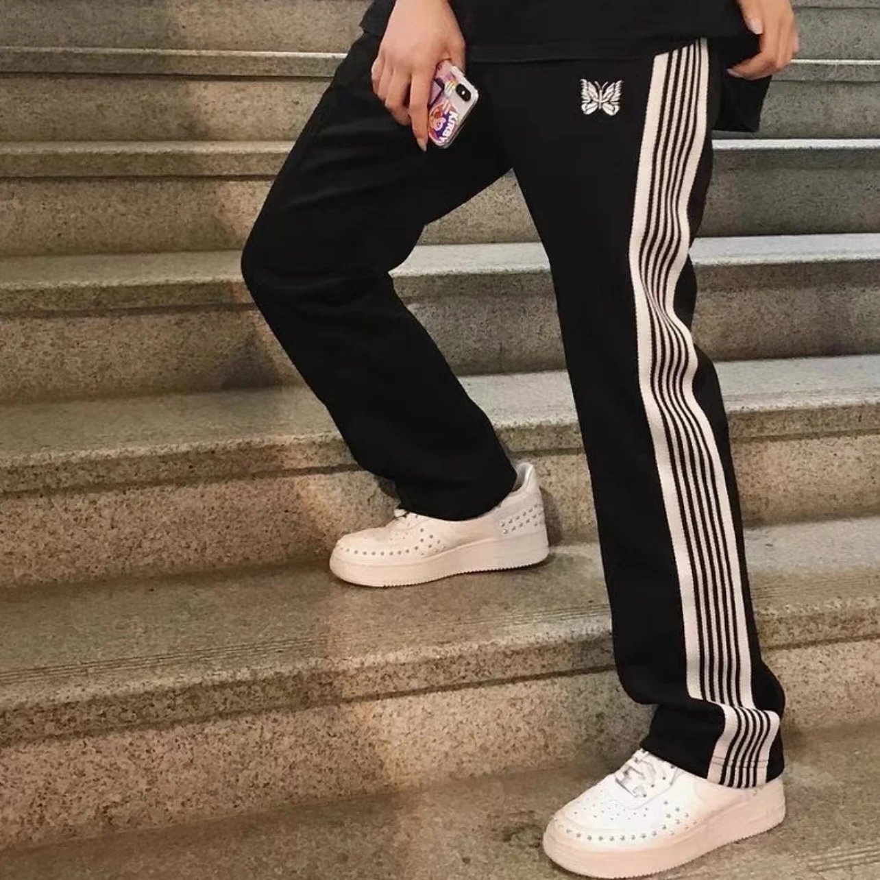 Needles-Inspired Black Track Pants with Butterfly Logo and Side Stripes