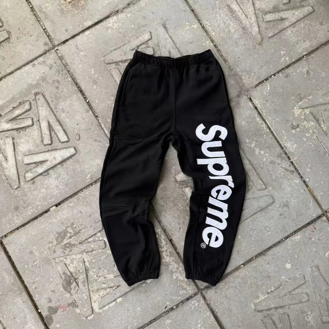 Supreme Hoodies & Sweatshirts Logo Hoodie with Contrast Stitching — Black sweatpants with a large logo