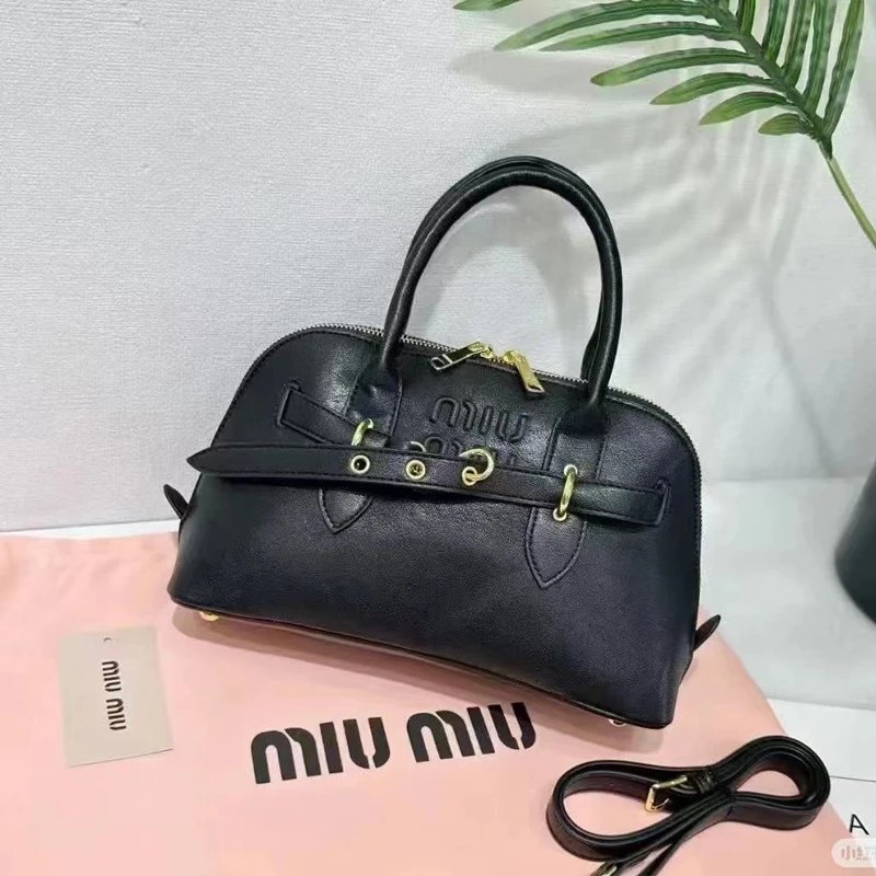 Miu Handbags Dome handbag with belt-style gold-tone hardware and detachable shoulder strap — Black