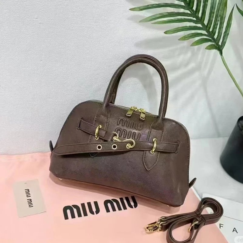 Miu Handbags Dome handbag with belt-style gold-tone hardware and detachable shoulder strap — Heatherwood color