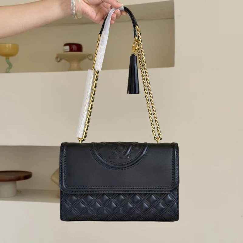 Tory Burch Shoulder Bags Quilted flap bag with chain strap and tassel — Black