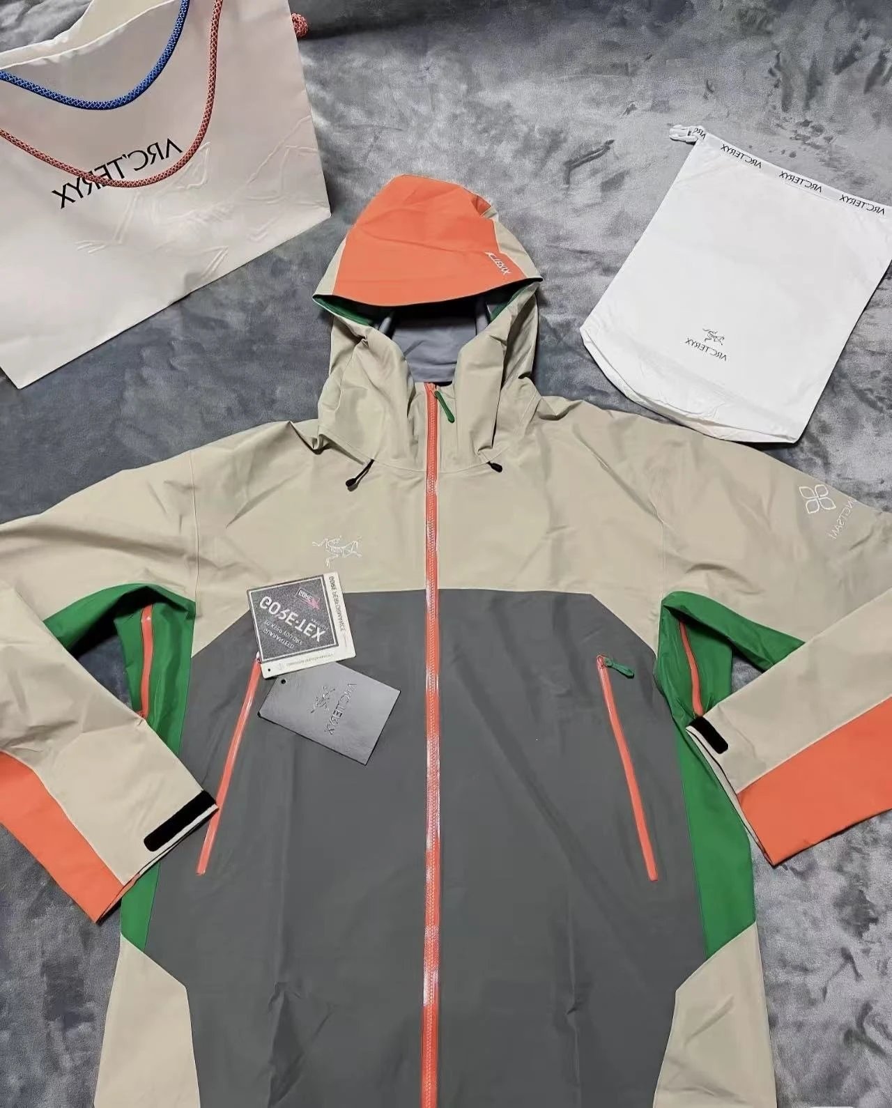 Arc'teryx Jackets Hooded color-block shell jacket with zip pockets — South Gabava