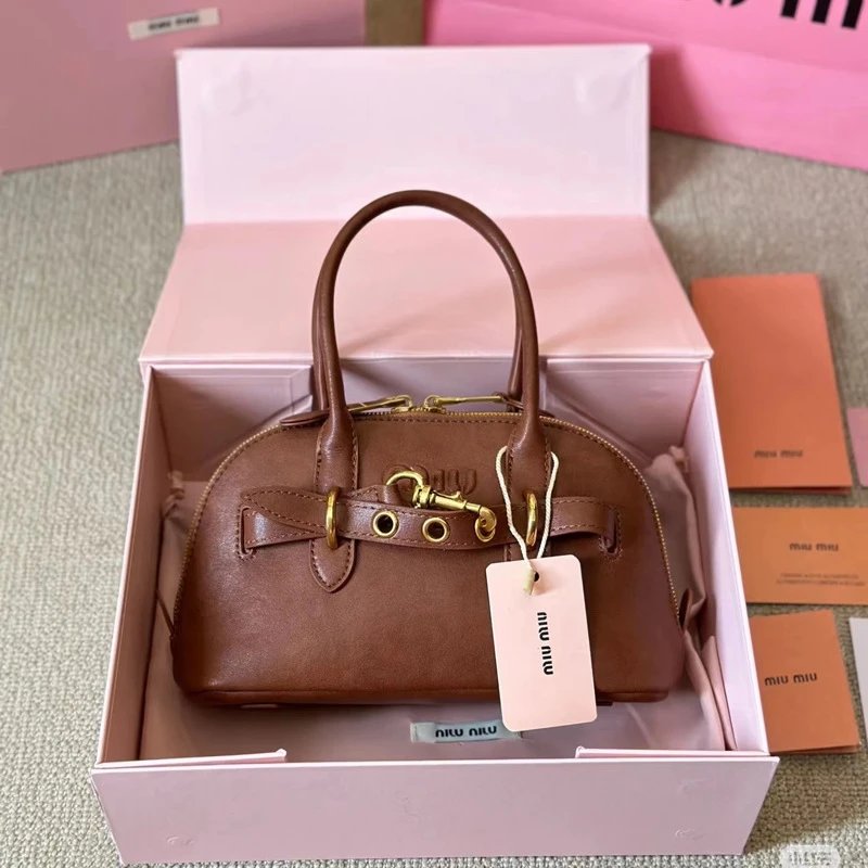 Miu Handbags Dome handbag with belt-style gold-tone hardware and detachable shoulder strap image 4