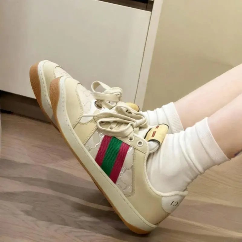 Gucci Sneakers Screener low-top lace-up with Web stripes and GG pattern panels — rice white tail