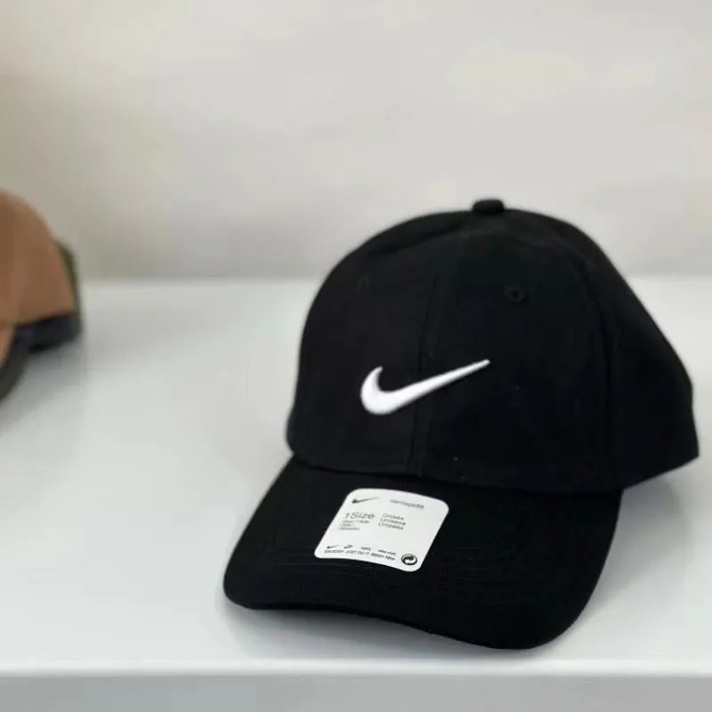 Nike Hats Washed cotton baseball cap with embroidered logo — Black with white hook
