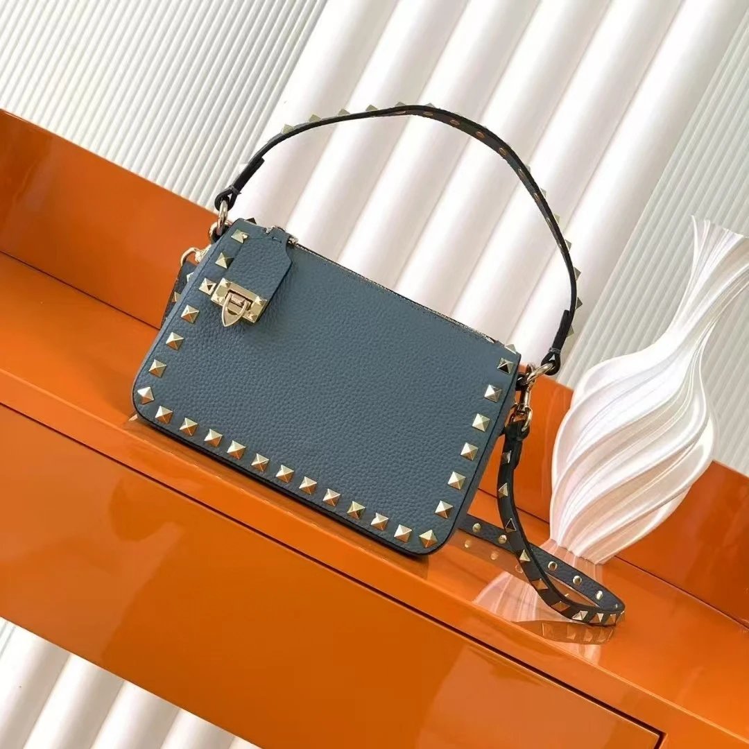 Valentino Garavani Crossbody Bags Rockstud small leather bag — Blue