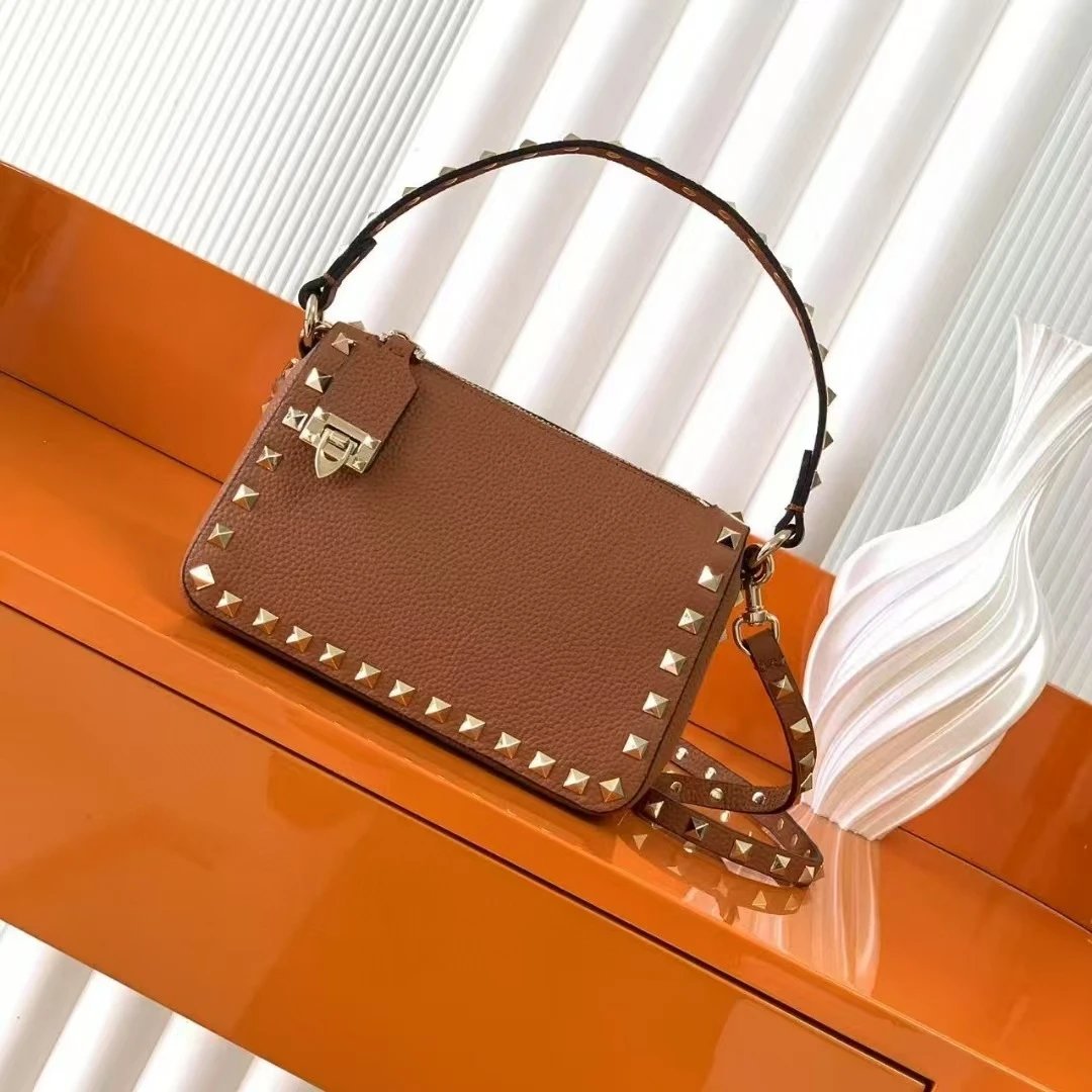 Valentino Garavani Crossbody Bags Rockstud small leather bag — Brown