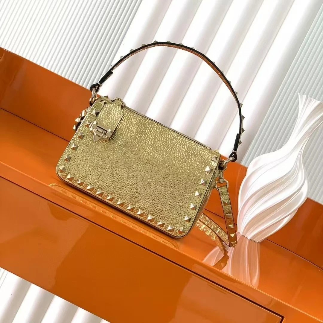 Valentino Garavani Crossbody Bags Rockstud small leather bag — Golden