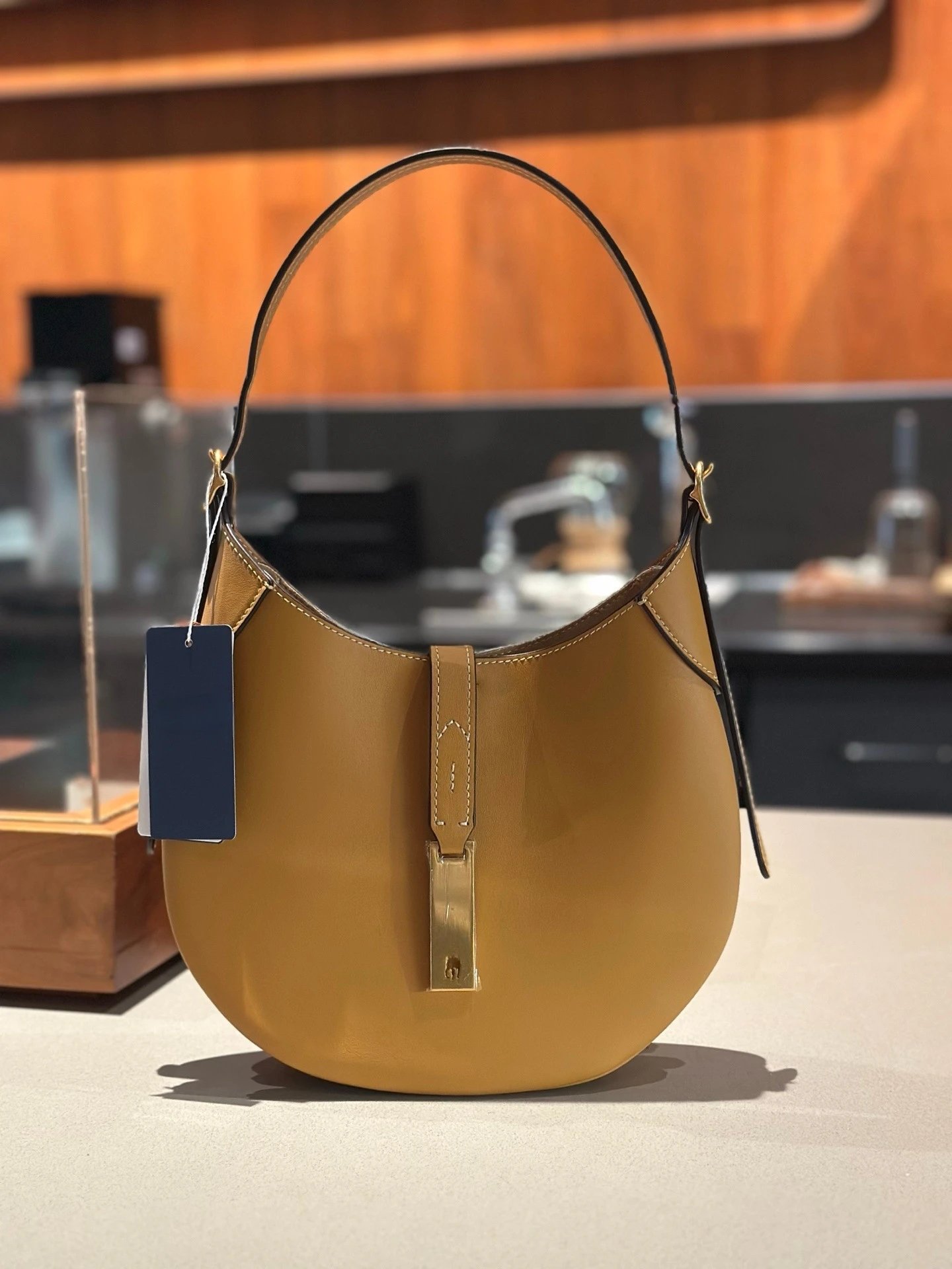 Unbranded Shoulder Bags Crescent Hobo Bag with Gold-Tone Horse Emblem — Light brown