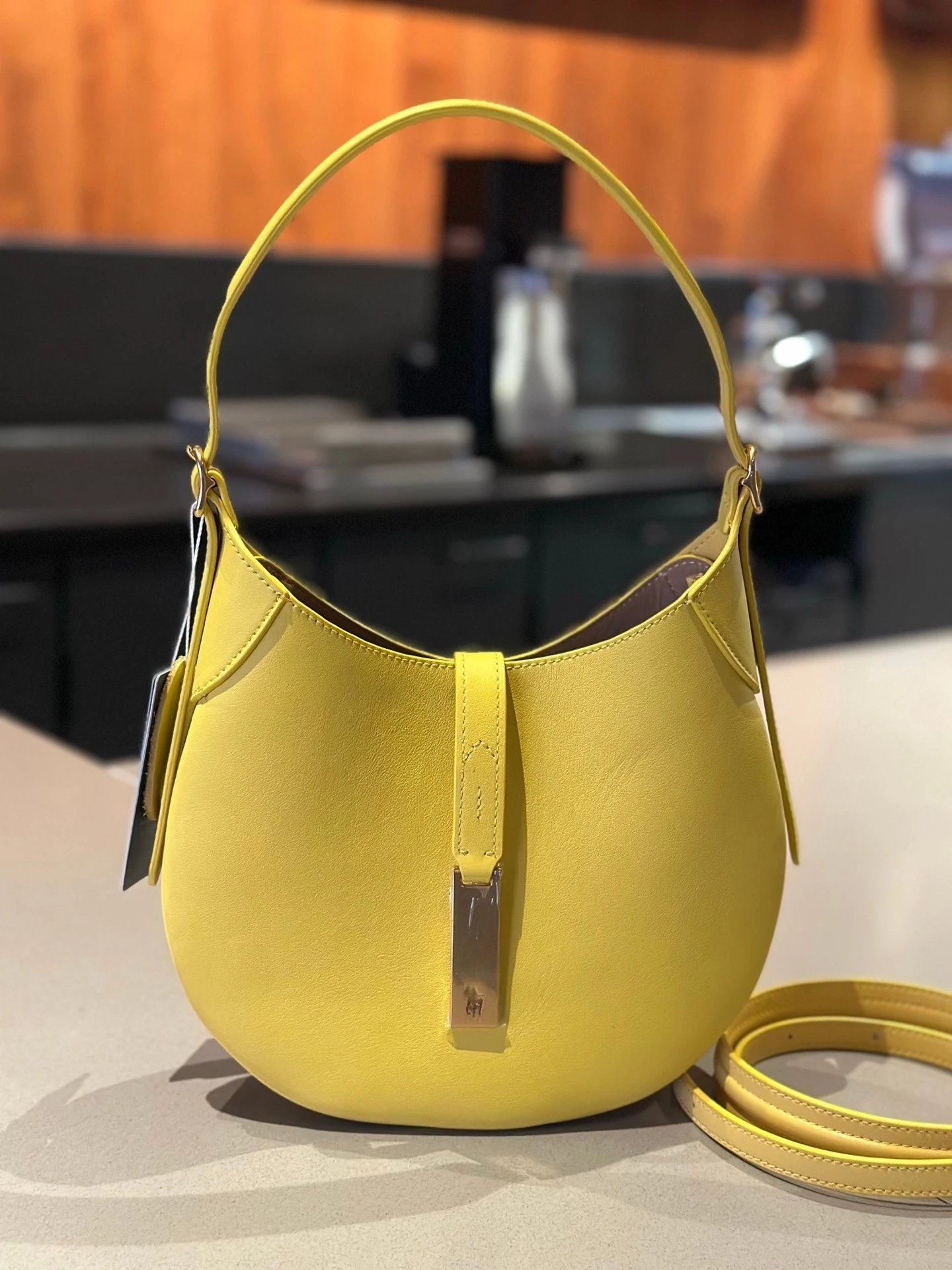 Unbranded Shoulder Bags Crescent Hobo Bag with Gold-Tone Horse Emblem — Yellow