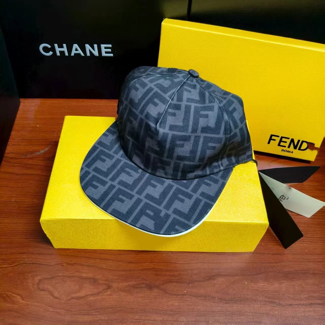 Fendi Hats FF Monogram Baseball Cap — Black, with a box.
