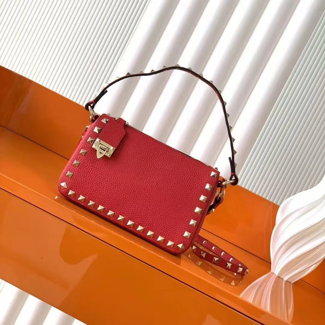 Valentino Garavani Crossbody Bags Rockstud small leather bag — Red