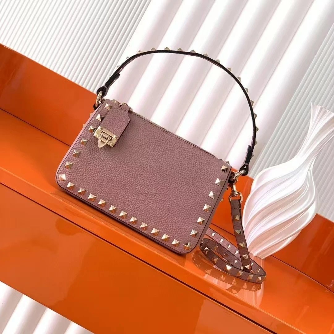 Valentino Garavani Crossbody Bags Rockstud small leather bag — Naked Pink