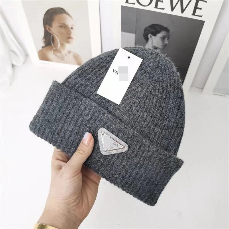 Prada Hats Ribbed Knit Beanie with Triangle Logo Plaque — Dark gray