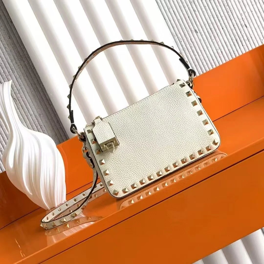 Valentino Garavani Crossbody Bags Rockstud small leather bag — white