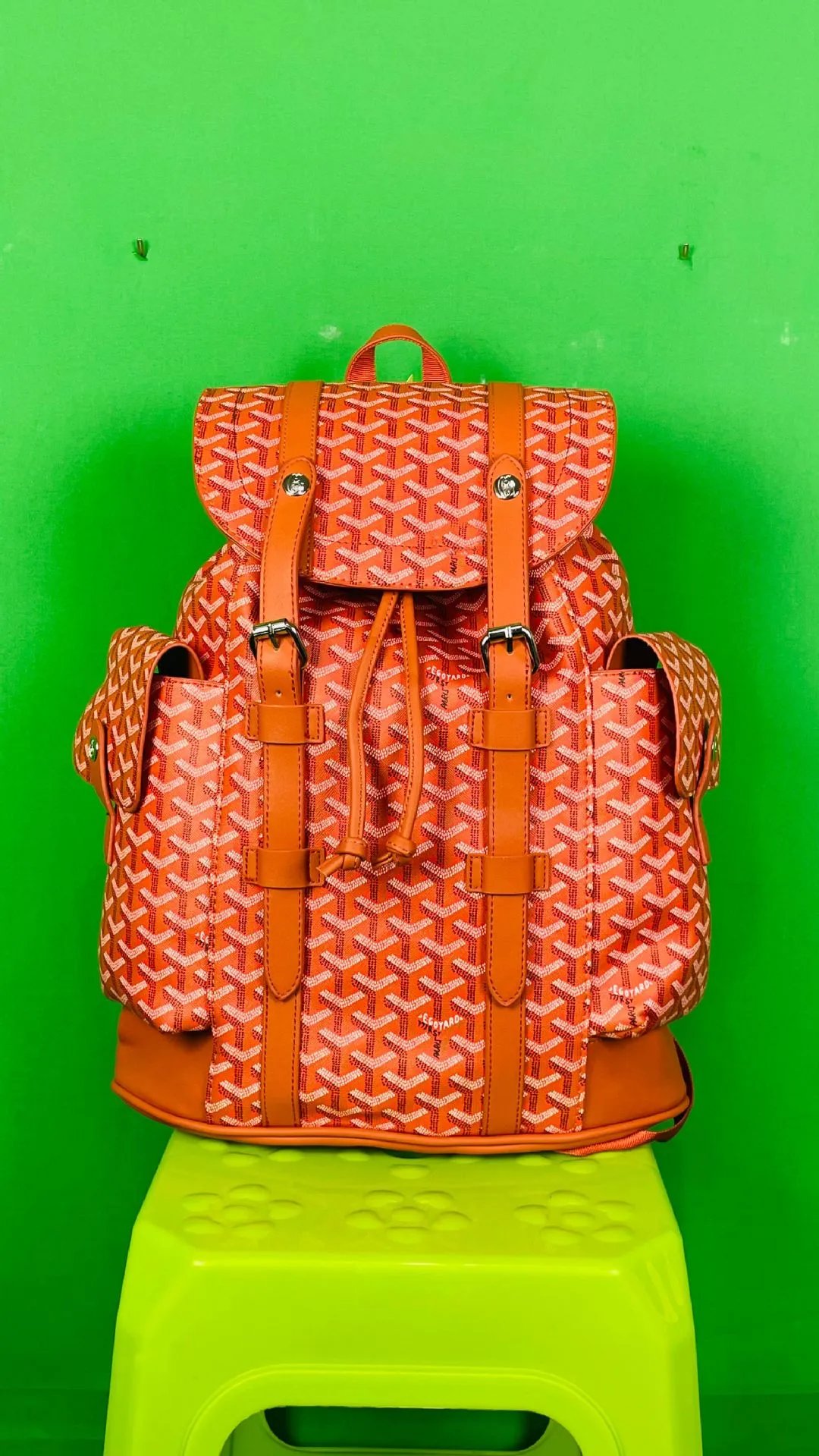 Goyard Backpacks Monogram flap backpack with side pockets — orange