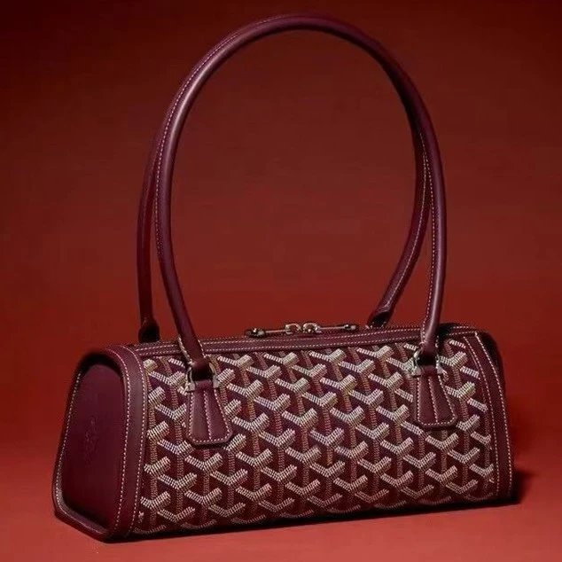 Unbranded Handbags Cylindrical baguette handbag with chevron pattern image 1