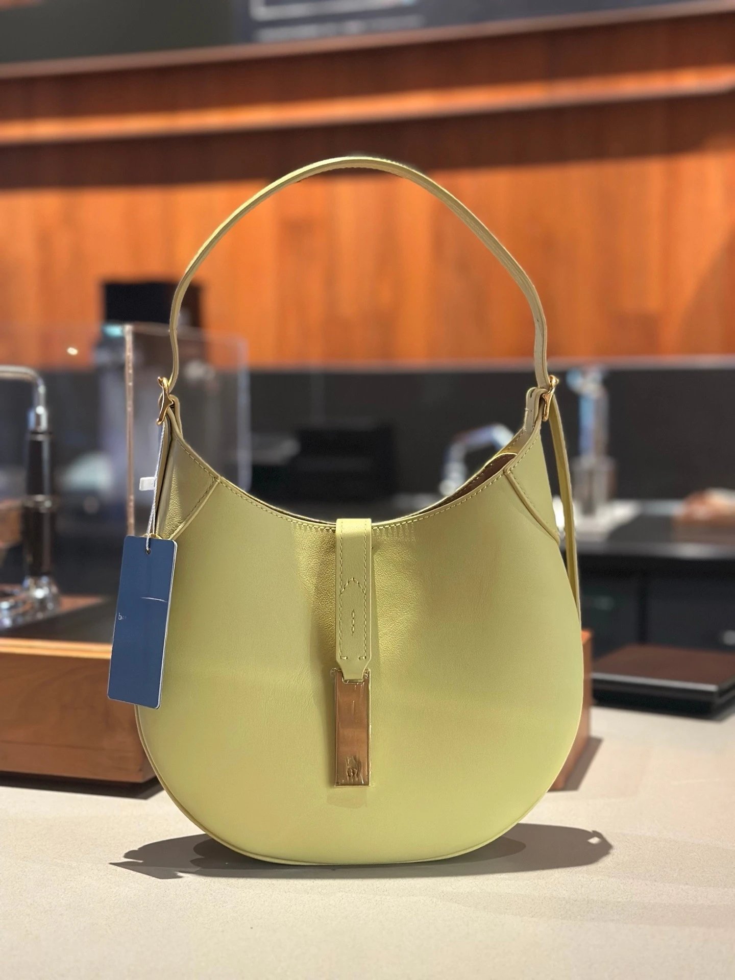 Unbranded Shoulder Bags Crescent Hobo Bag with Gold-Tone Horse Emblem — Light yellow