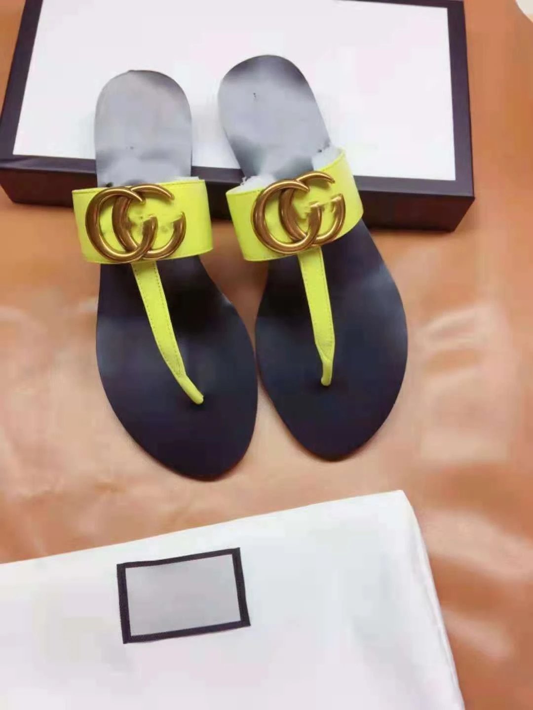 Gucci Sandals Flat thong with Double G hardware — Yellow