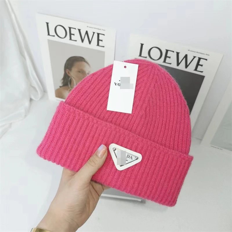Prada Hats Ribbed Knit Beanie with Triangle Logo Plaque — Rose red