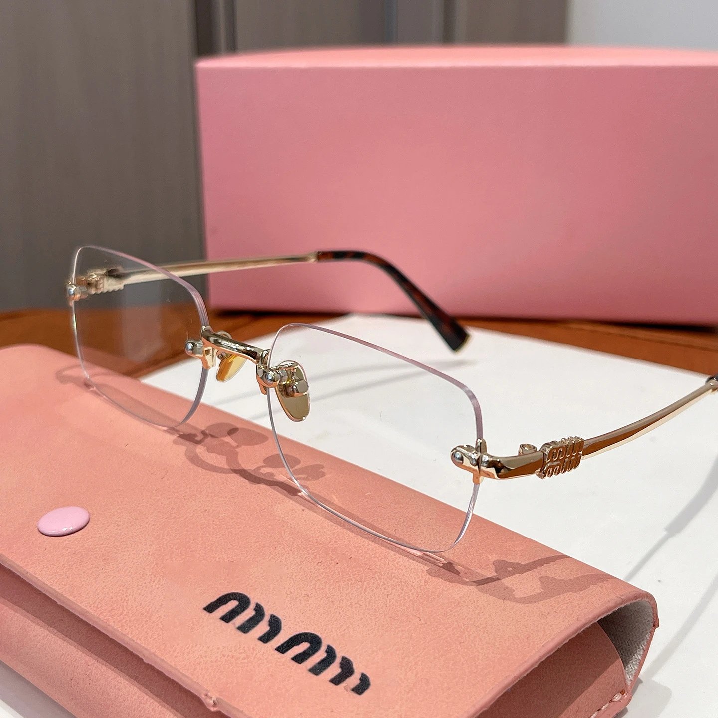 Miu Eyewear Rimless rectangular sunglasses — Jin Ping Guang