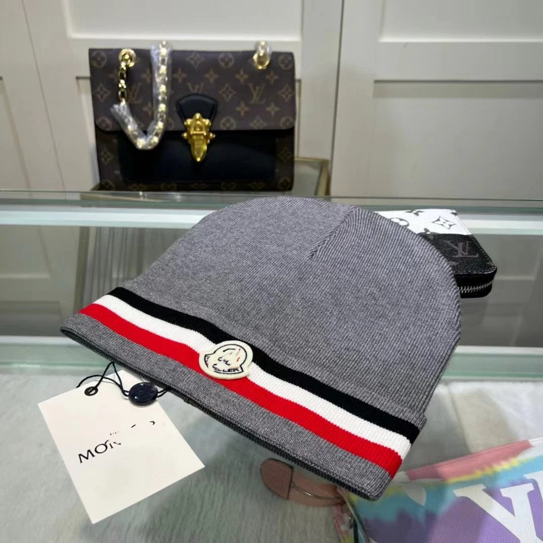 Moncler Hats Knitted beanie with tricolor stripe and logo patch — gray